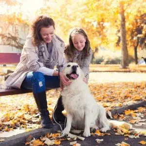 mother daughter dog in park.jpg